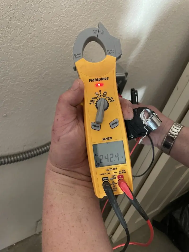 Voltage testing with clamp meter during Electrical Installation Services in Charlton